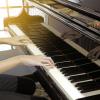 piano player playing a piano